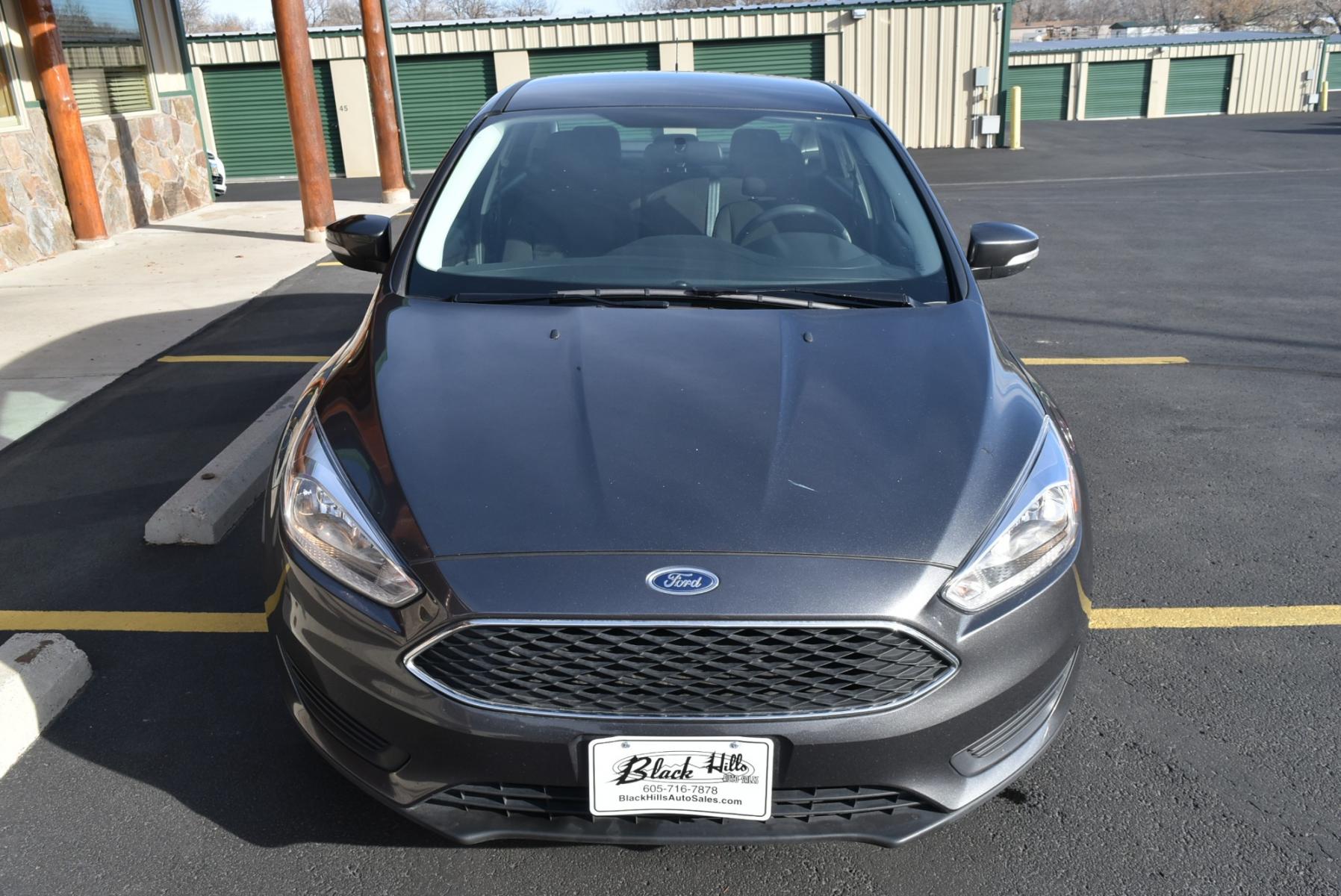 2016 Gray /Black Ford Focus SE (1FADP3F26GL) with an 2.0L I-4 GDI TI-VCT FLEX FUEL engine, 6-Speed Powershift Automatic transmission, located at 1600 E Hwy 44, Rapid City, SD, 57703, (605) 716-7878, 44.070232, -103.171410 - Photo #1